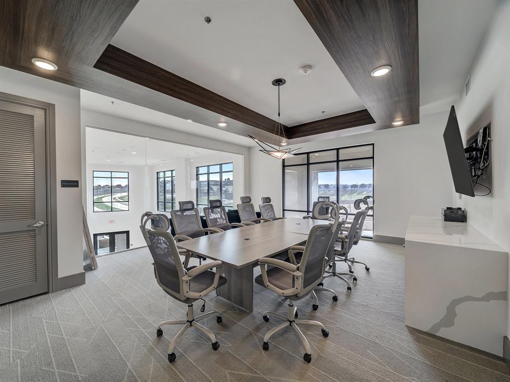 2700 Old Denton Road, Unit 4407 Carrollton, TX 75007 - Photo 20 of 34 a view of a dining room with furniture and wooden floor