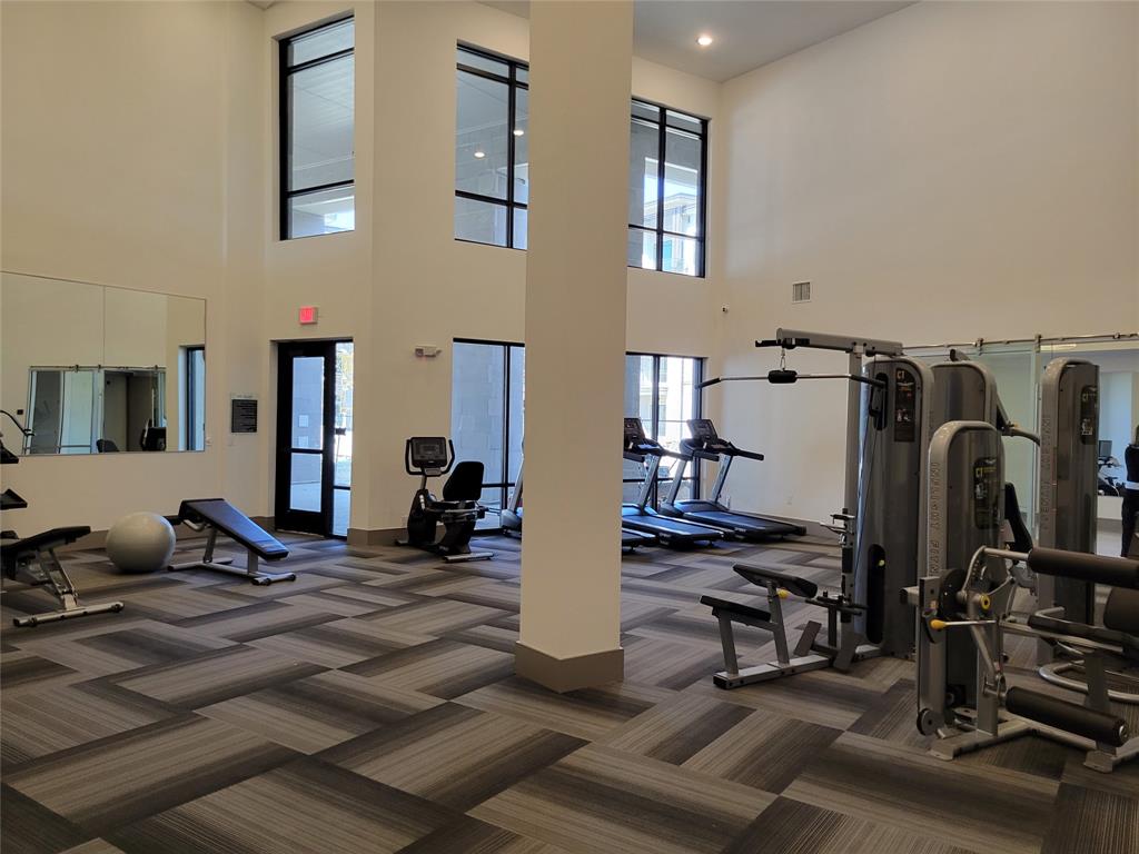 2700 Old Denton Road, Unit 4407 Carrollton, TX 75007 - Photo 28 of 34 a view of a room with gym equipment