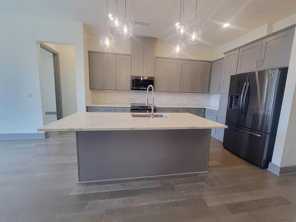 2700 Old Denton Road, Unit 4407 Carrollton, TX 75007 - Photo 8 of 34 a bathroom with a sink a large mirror and a shower