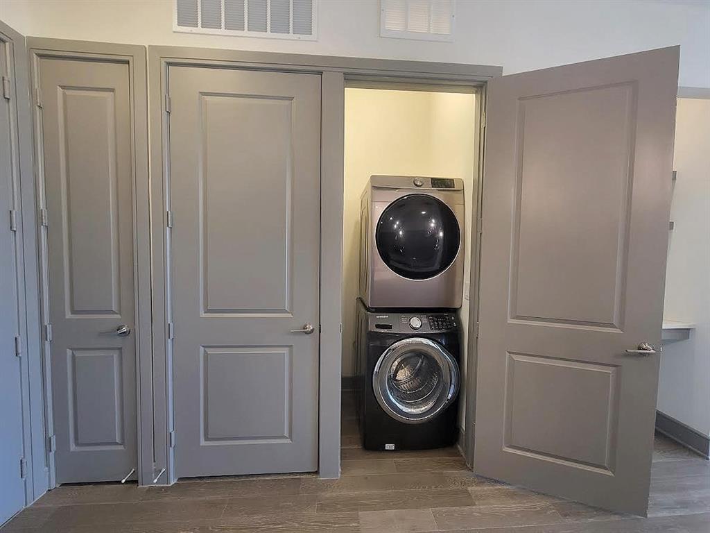 2700 Old Denton Road, Unit 4407 Carrollton, TX 75007 - Photo 9 of 34 a utility room with dryer washer and a view of bedroom
