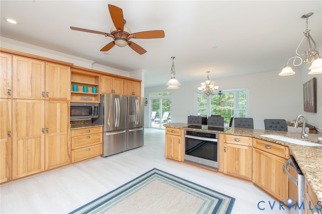11081 Shannon Hill Road Louisa, VA 23093 - Photo 14 of 49 a kitchen that has a lot of cabinets in it and stainless steel appliances