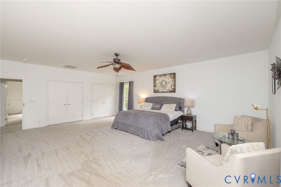11081 Shannon Hill Road Louisa, VA 23093 - Photo 19 of 49 a living room with furniture and a chandelier