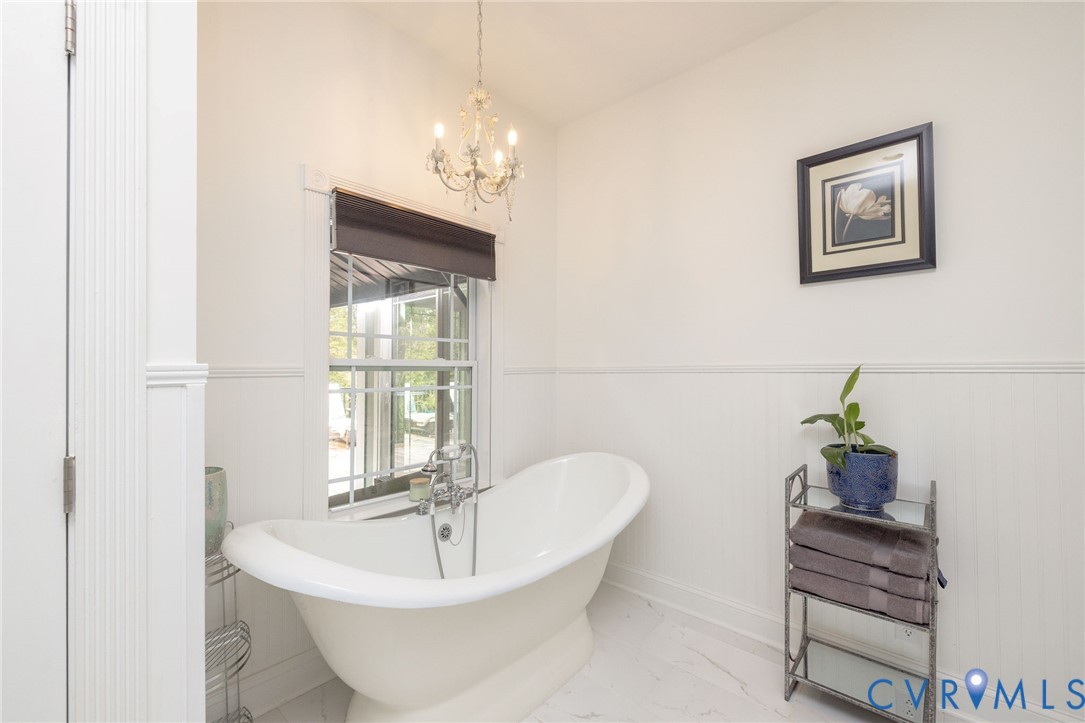 11081 Shannon Hill Road Louisa, VA 23093 - Photo 22 of 49 a bath room with a mirror and a table