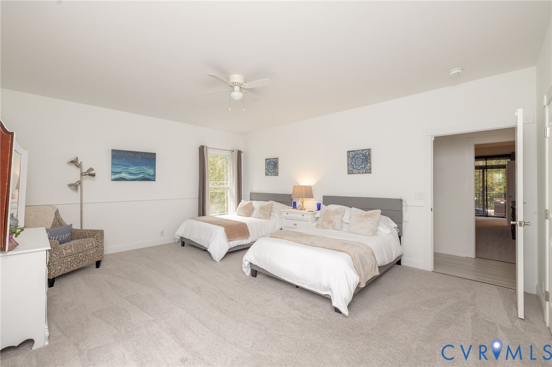 11081 Shannon Hill Road Louisa, VA 23093 - Photo 25 of 49 a spacious bedroom with a bed and a couch