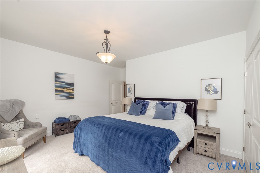 11081 Shannon Hill Road Louisa, VA 23093 - Photo 27 of 49 a bedroom with a bed and a couch