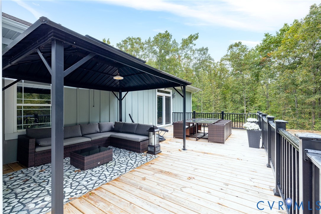 11081 Shannon Hill Road Louisa, VA 23093 - Photo 35 of 49 a view of a roof deck with couches and potted plants