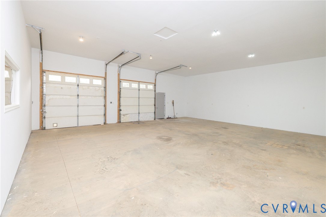 11081 Shannon Hill Road Louisa, VA 23093 - Photo 44 of 49 an empty room with windows and pillars in it