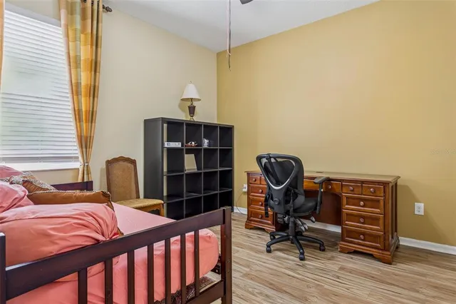 a bathroom with a sink a toilet and shower curtain