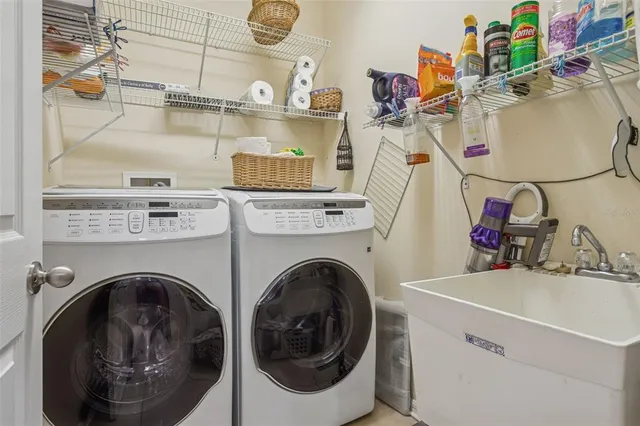 a living room with patio furniture and a large window