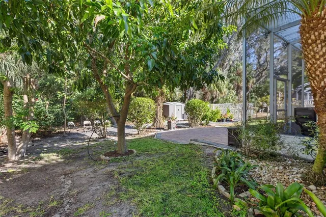 a garden with trees in front of it