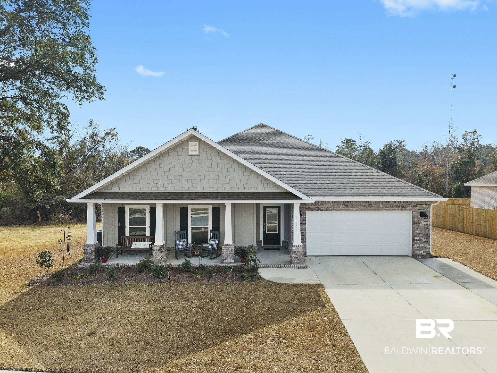 1141 Pencarro Boulevard Foley, AL 36535 - Photo 1 of 70 Craftsman-style house featuring a garage, covered porch, and a front yard
