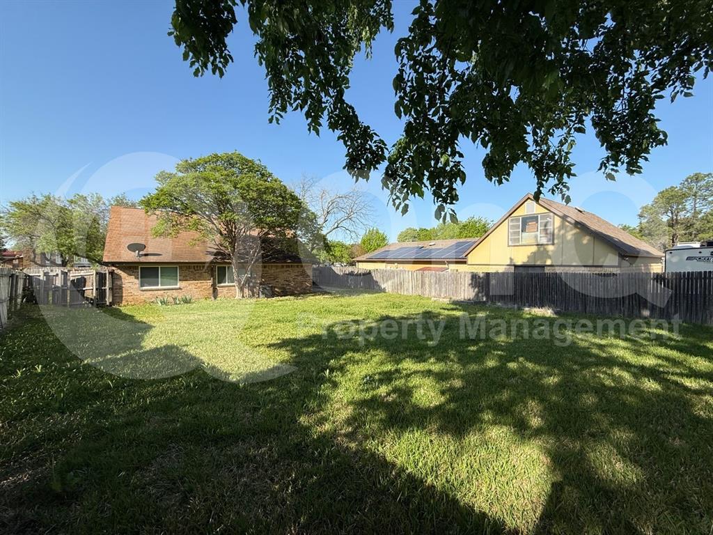 3005 Meandering Way Bedford, TX 76021 - Photo 23 of 24 Expansive green lawn with mature trees providing partial shade