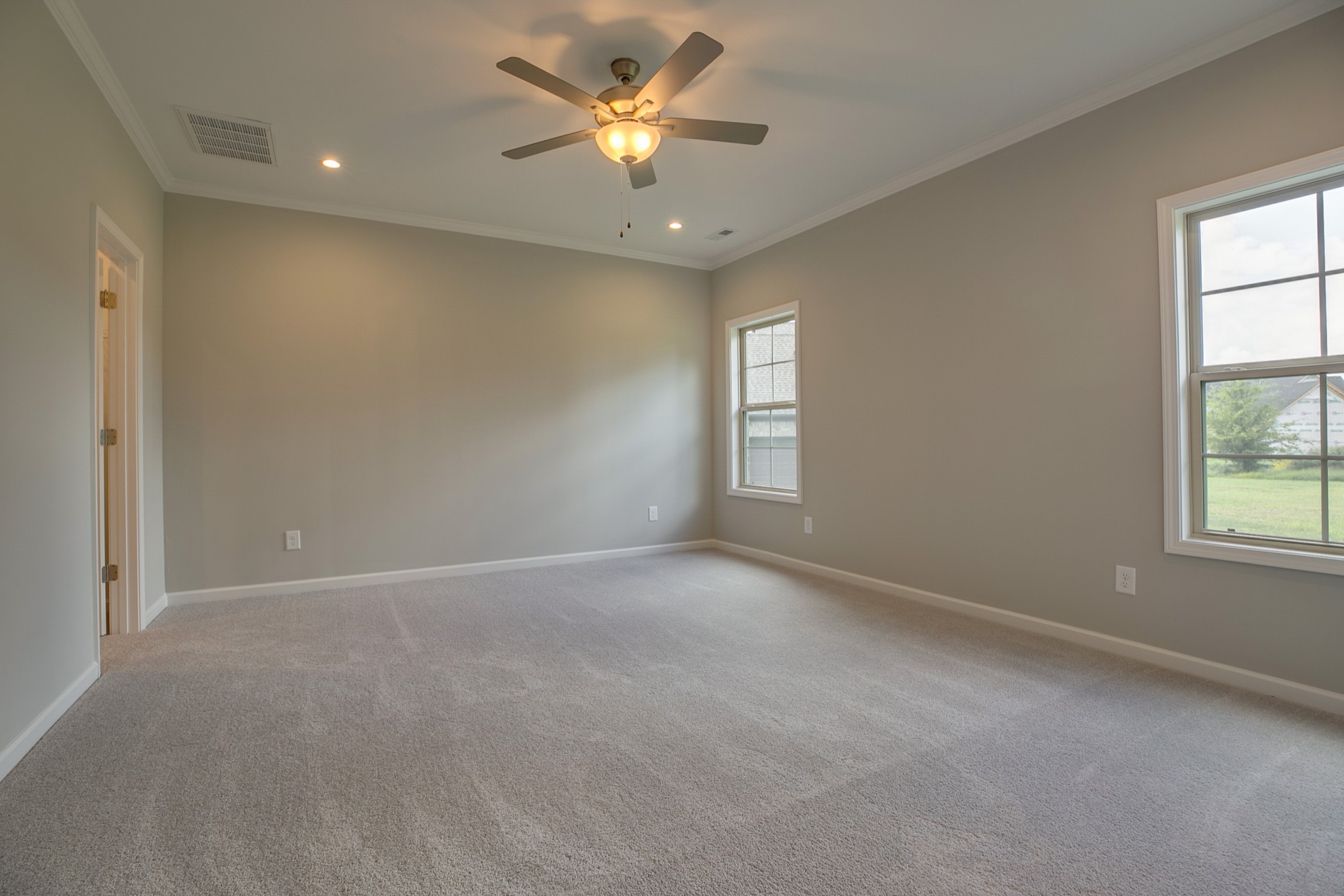 248 Doak Road Manchester, TN 37355 - Photo 11 of 23 an empty room with windows and fan