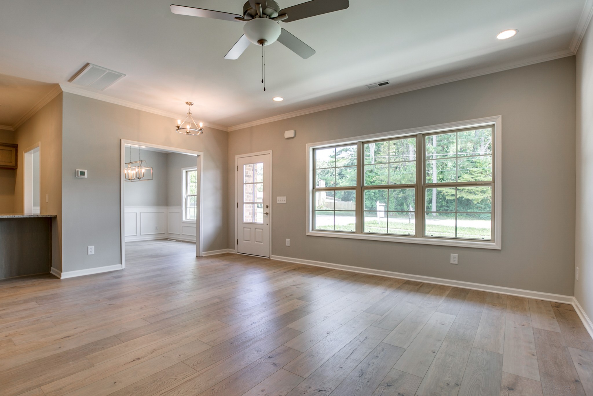 248 Doak Road Manchester, TN 37355 - Photo 4 of 23 a view of an empty room with wooden floor and a window
