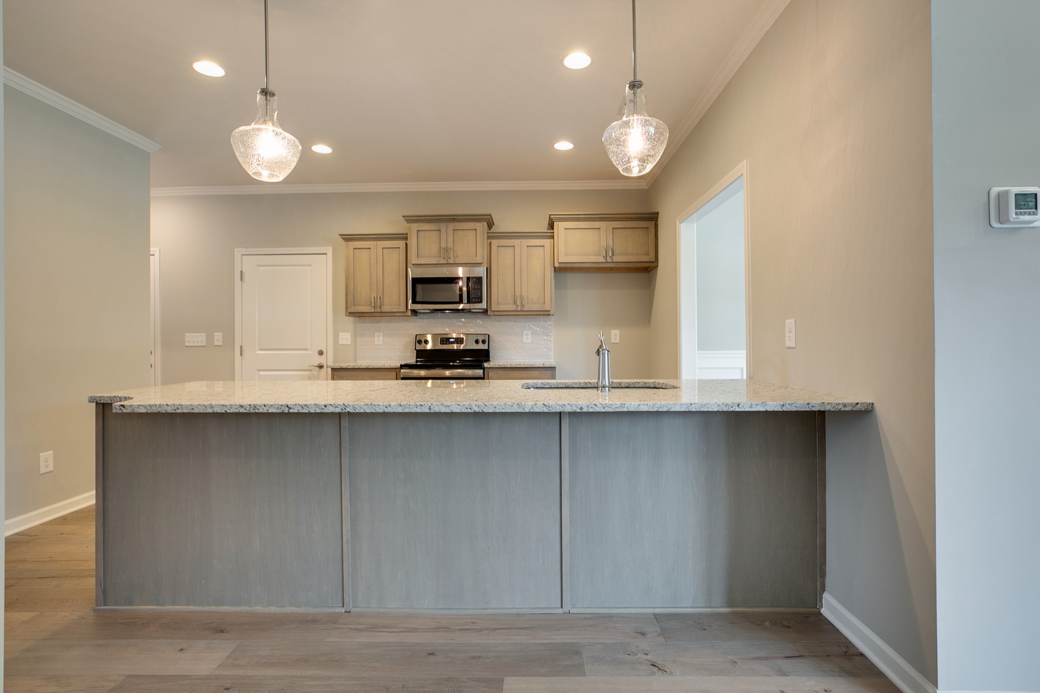 248 Doak Road Manchester, TN 37355 - Photo 6 of 23 a kitchen with kitchen island a sink stainless steel appliances and cabinets