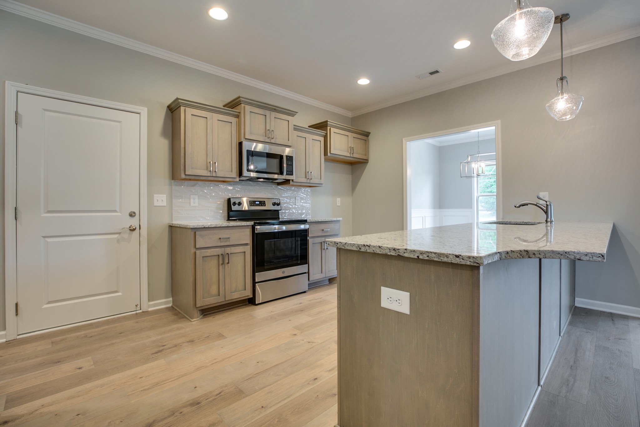 248 Doak Road Manchester, TN 37355 - Photo 7 of 23 a kitchen with stainless steel appliances granite countertop a sink stove and refrigerator