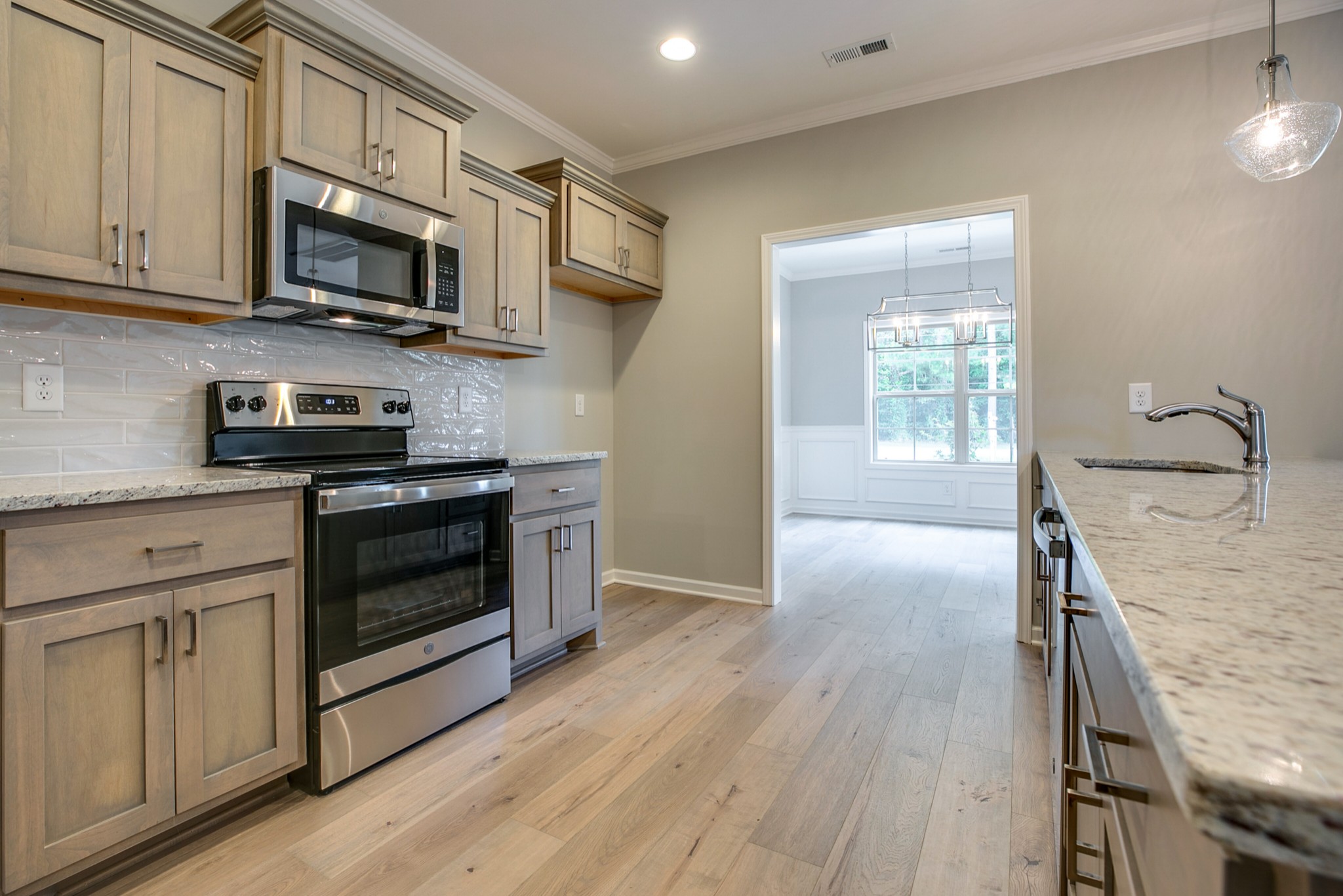 248 Doak Road Manchester, TN 37355 - Photo 8 of 23 a kitchen with stainless steel appliances a stove a microwave and cabinets