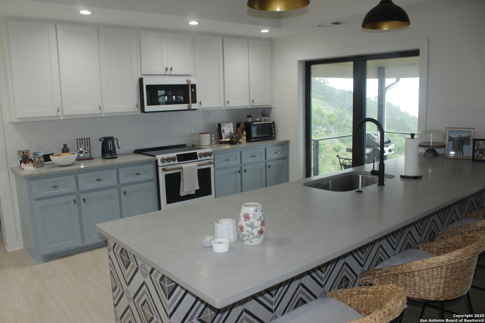 47 North Valley Vista Rio Frio, TX 78879 - Photo 5 of 8 a kitchen with a table chairs stove and cabinets