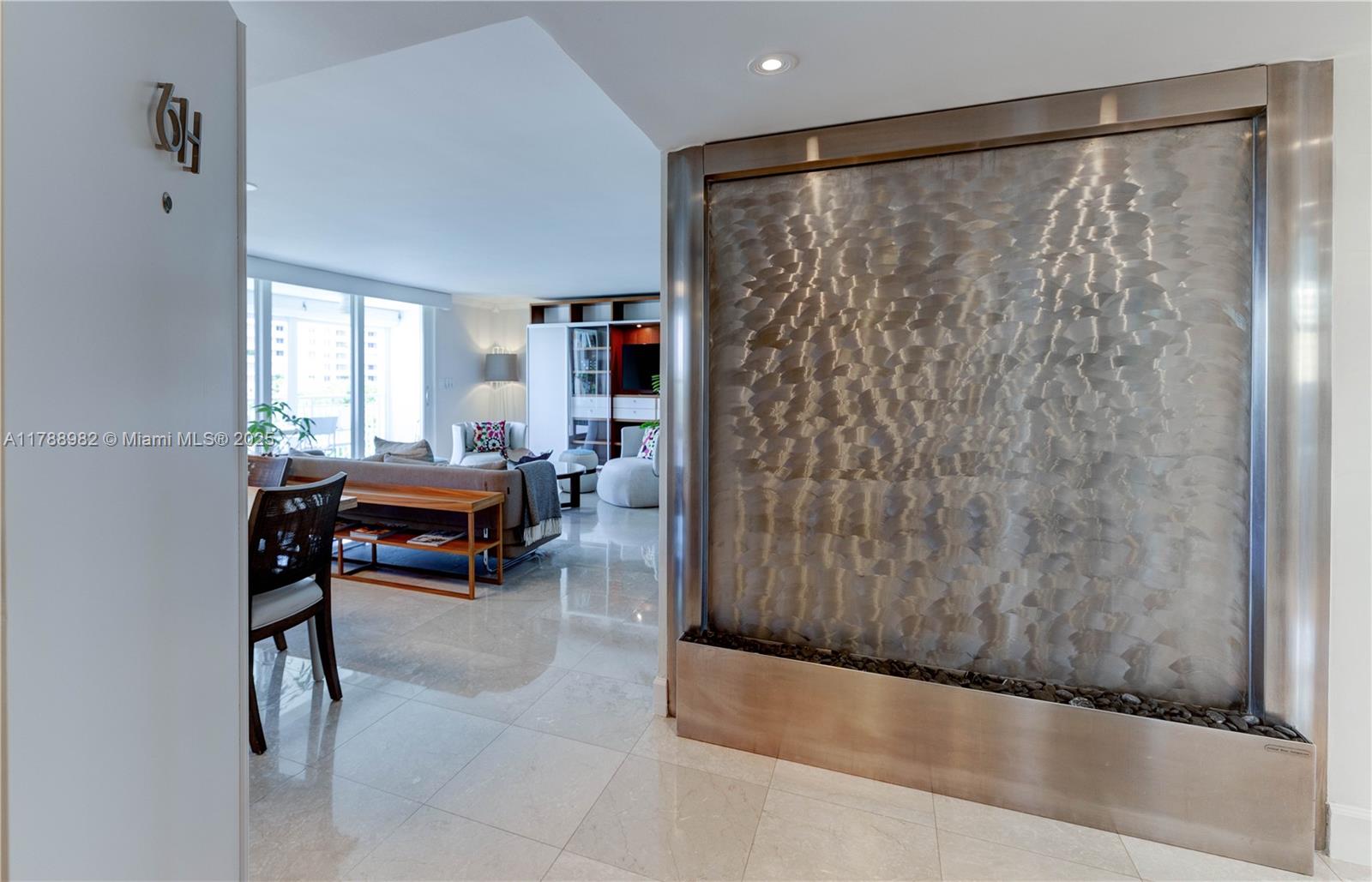 609 Ocean Drive, Unit 6H Key Biscayne, FL 33149 - Photo 13 of 32 a living room with furniture and a gate