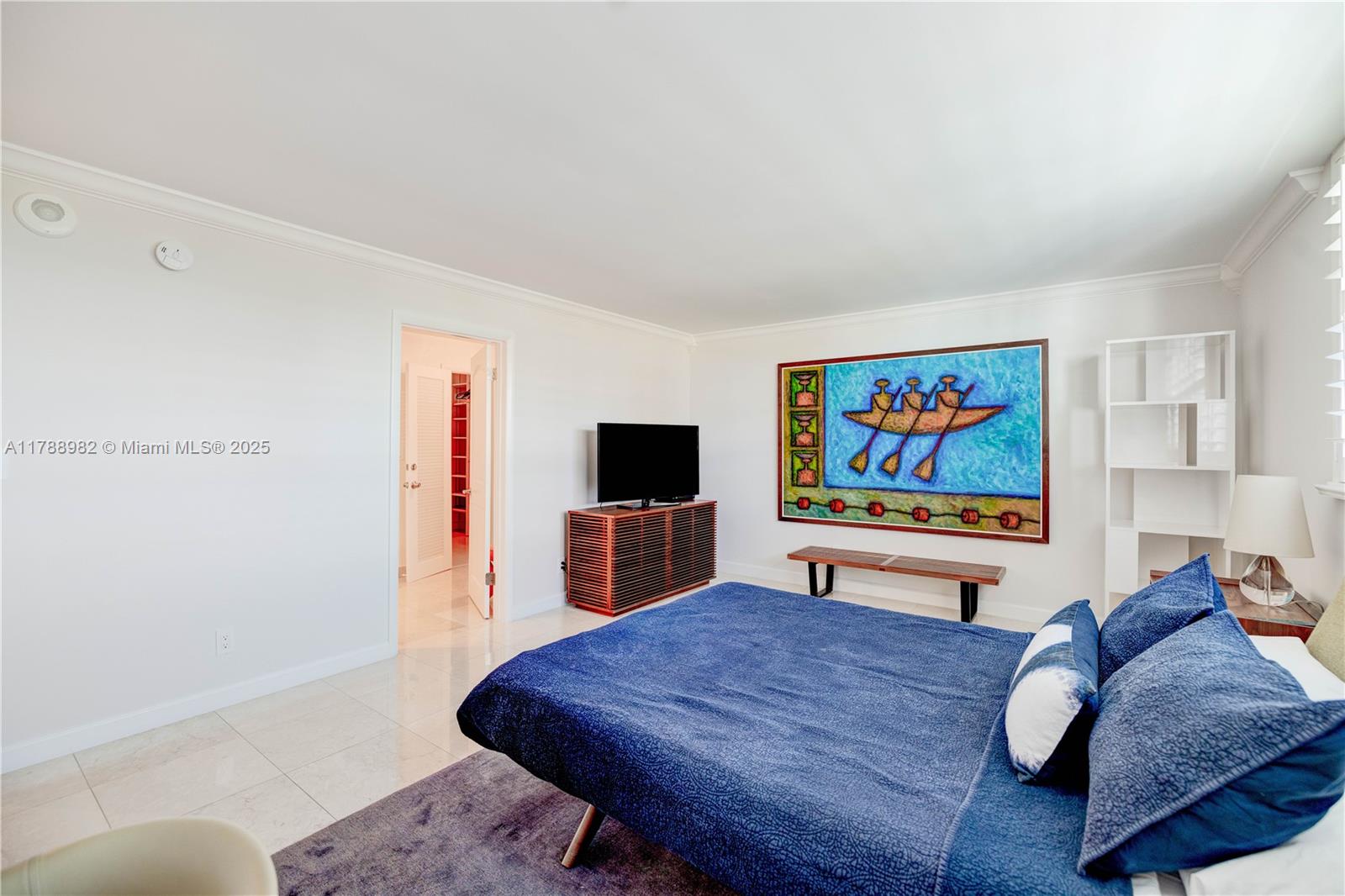 609 Ocean Drive, Unit 6H Key Biscayne, FL 33149 - Photo 16 of 32 a living room with furniture and a flat screen tv