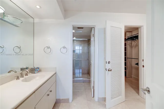 a bathroom with a double vanity sink and mirror