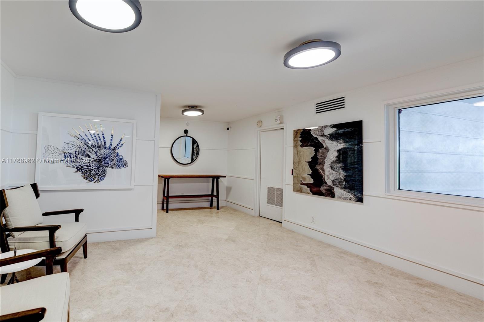 609 Ocean Drive, Unit 6H Key Biscayne, FL 33149 - Photo 25 of 32 a view of a room with furniture and a window