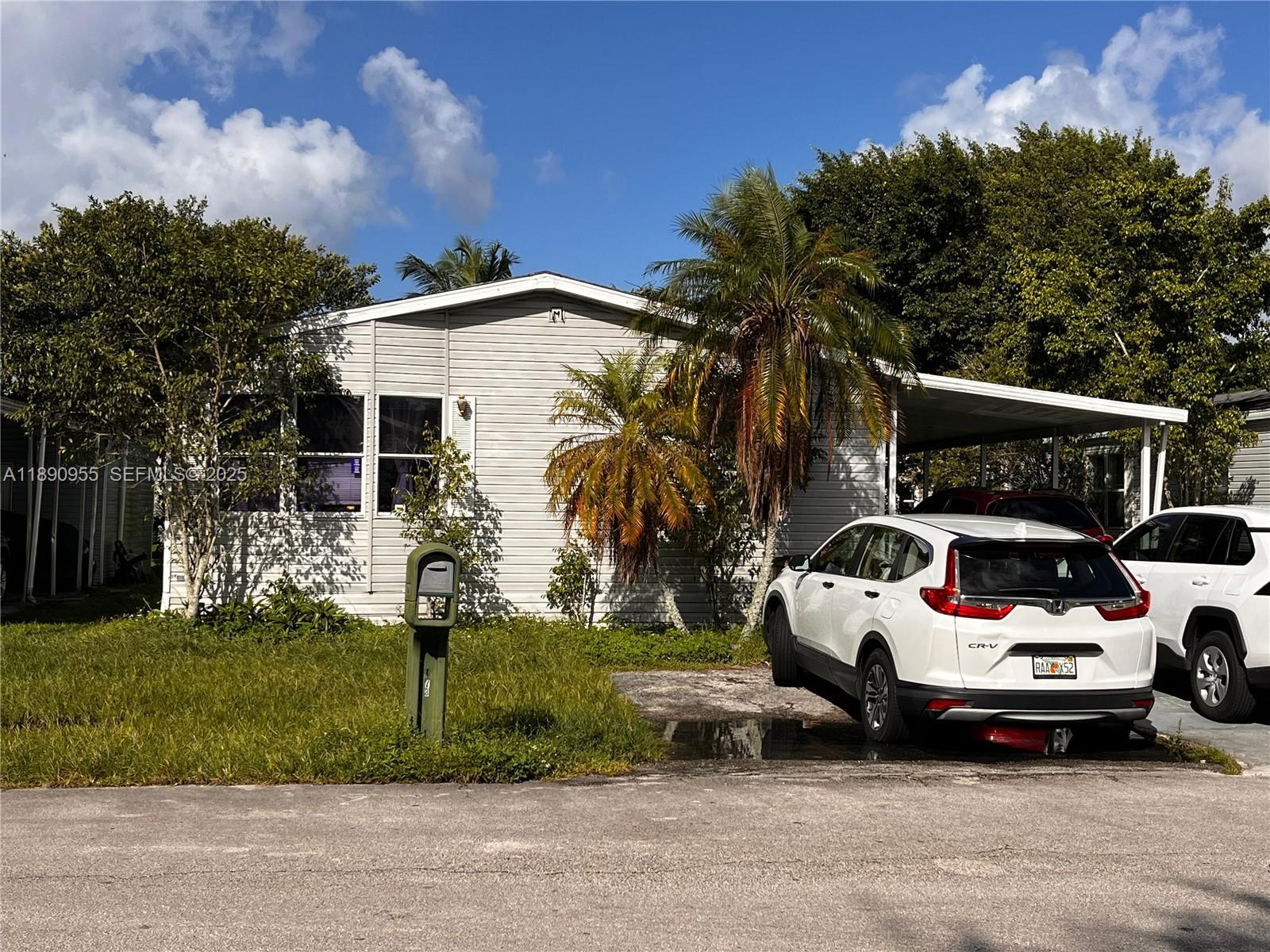 a view of a car parked in front of a house
