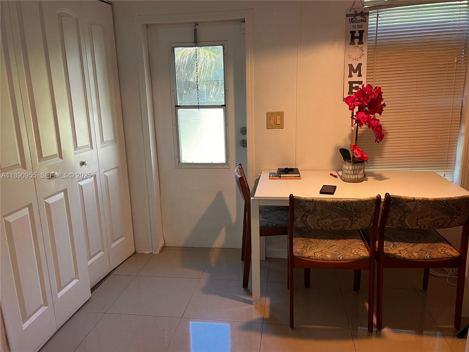 909 Southwest 131st Way Davie, FL 33325 - Photo 18 of 36 a dining room with furniture and window