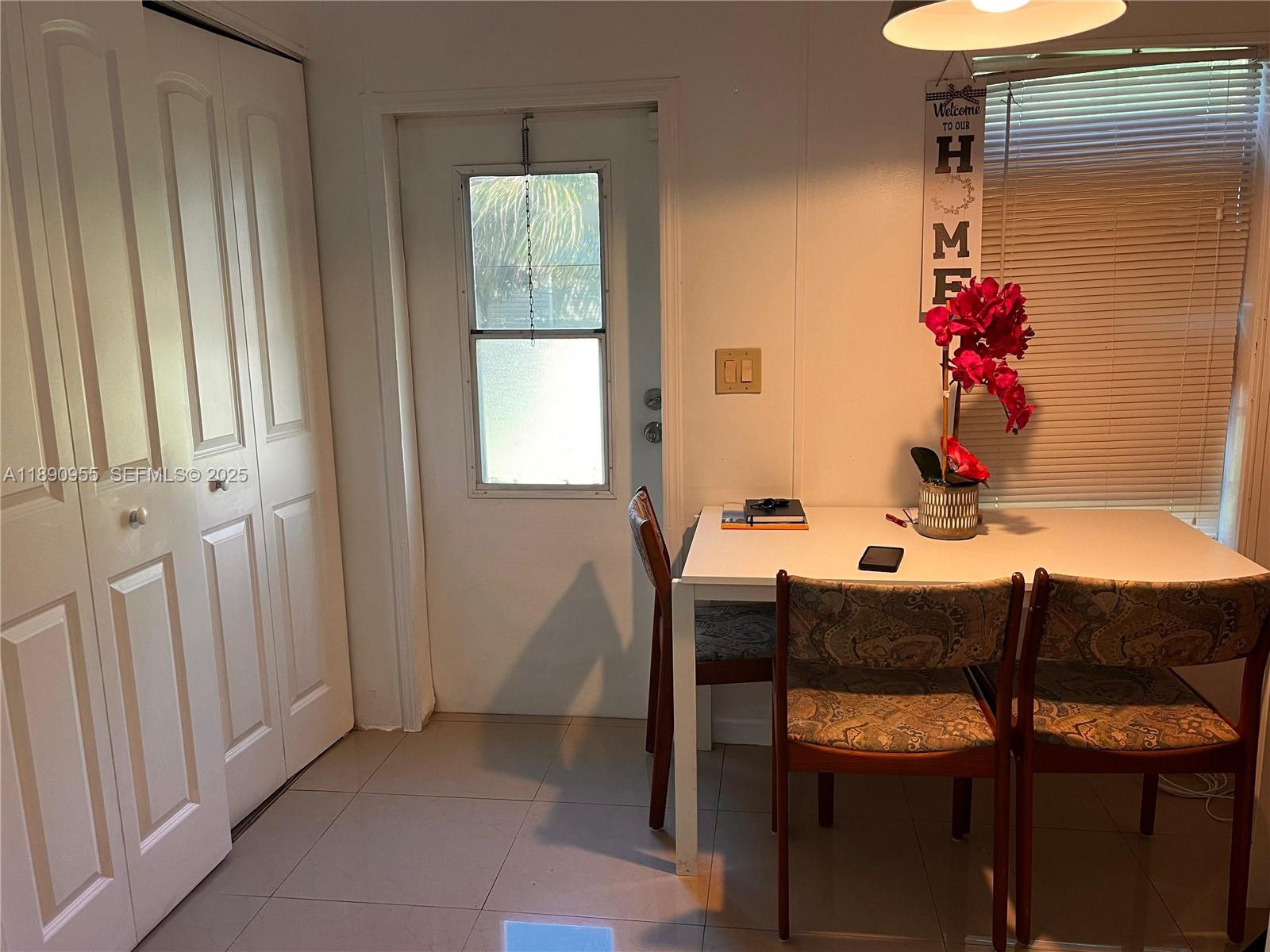 909 Southwest 131st Way Davie, FL 33325 - Photo 19 of 36 a dining room with furniture and window