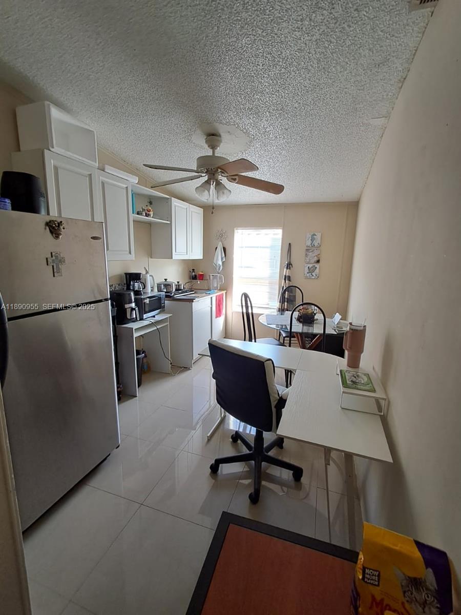 909 Southwest 131st Way Davie, FL 33325 - Photo 22 of 36 a workspace with wooden floor