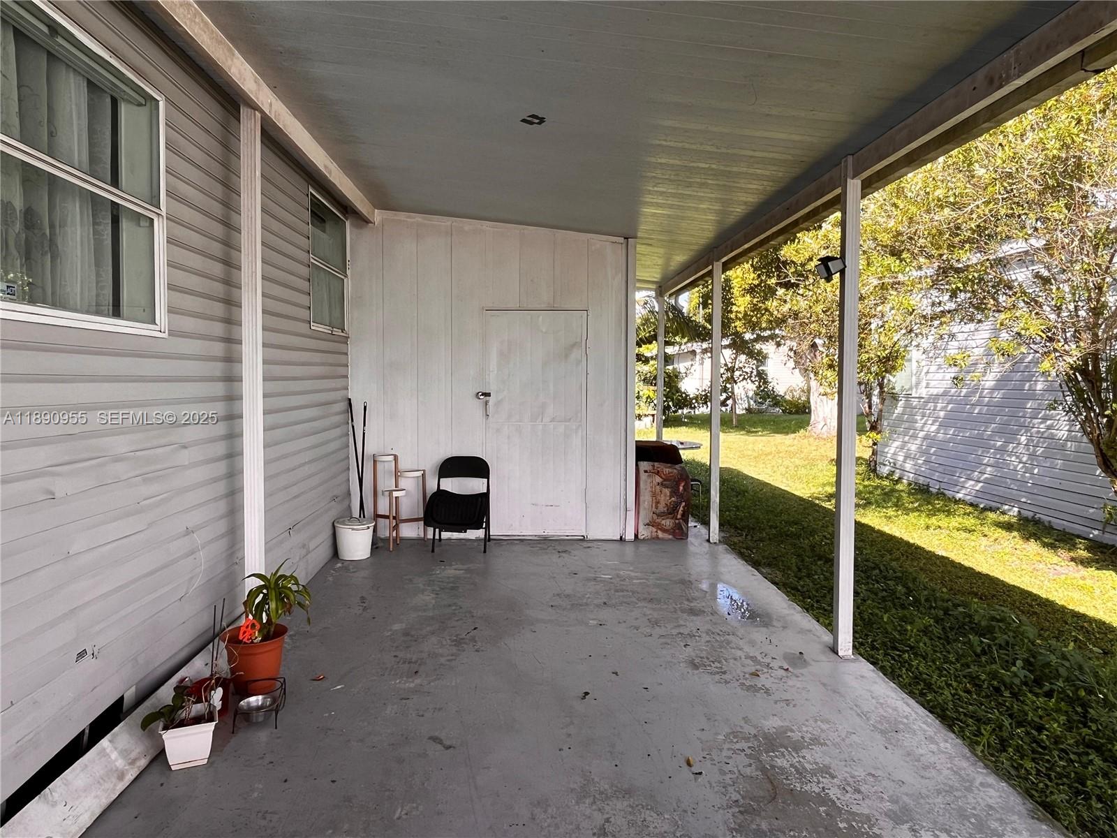 909 Southwest 131st Way Davie, FL 33325 - Photo 33 of 36 a view of a porch with backyard