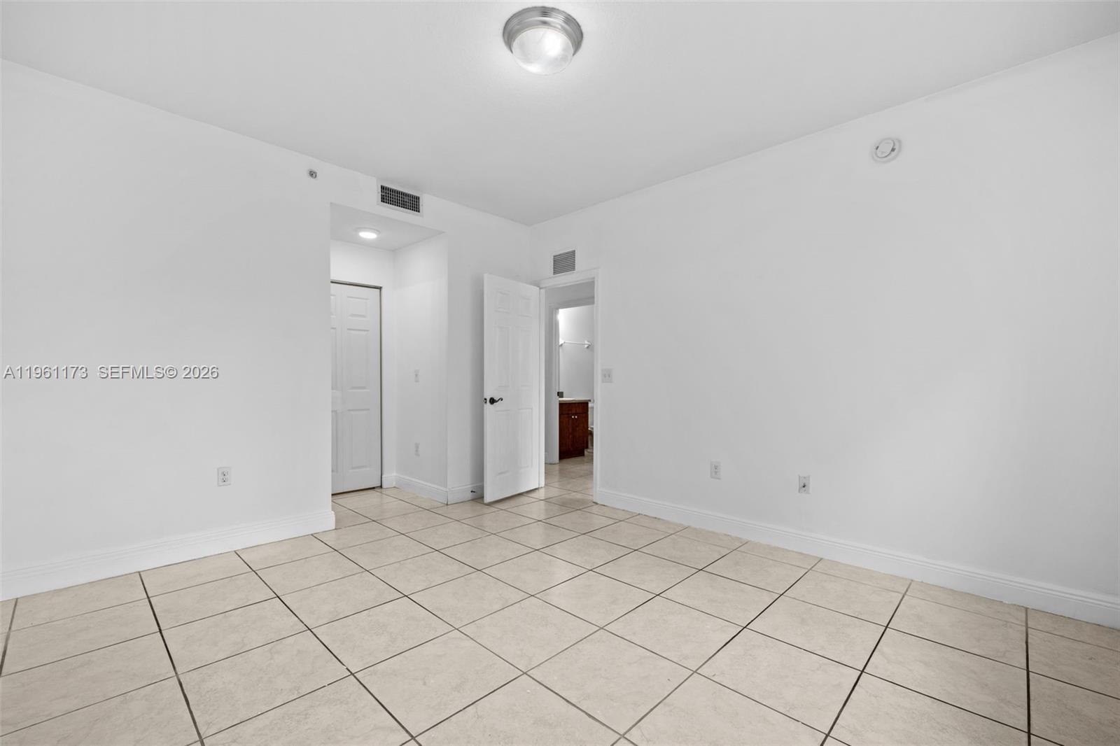2437 West 78th Street, Unit 104 Hialeah, FL 33016 - Photo 17 of 21 a view of an empty room