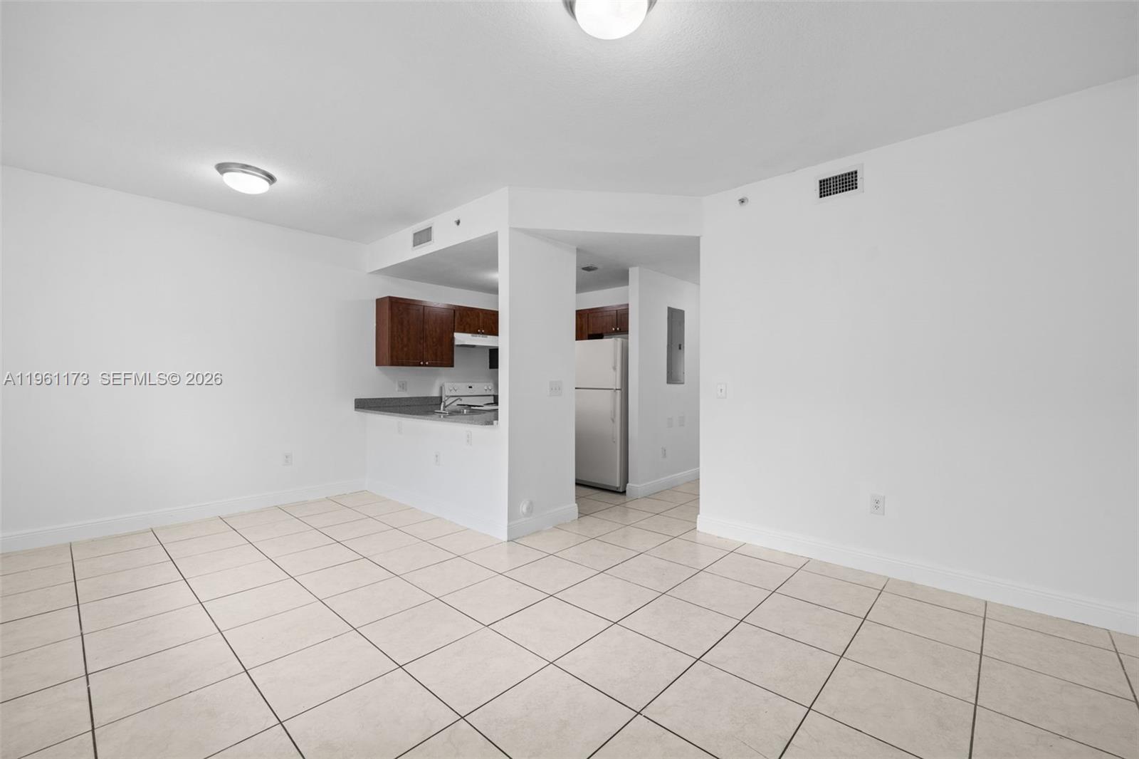 2437 West 78th Street, Unit 104 Hialeah, FL 33016 - Photo 7 of 21 a view of an empty room