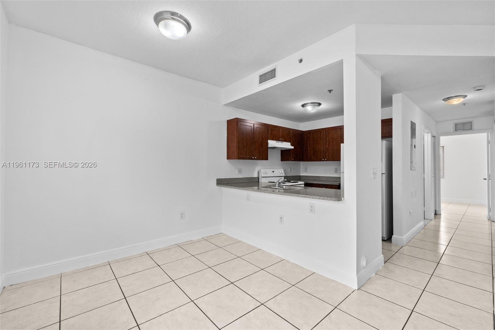 2437 West 78th Street, Unit 104 Hialeah, FL 33016 - Photo 9 of 21 a view of a kitchen with a sink