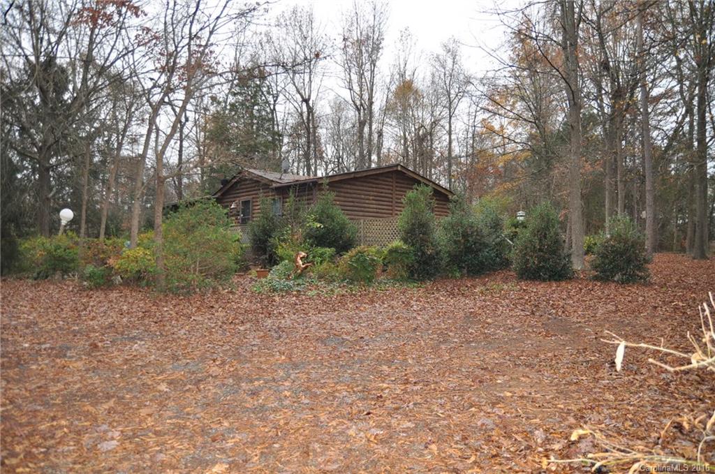 2919 Belk Mill Road Wingate, NC 28174 - Photo 1 of 24 a backyard of a house with lots of green space