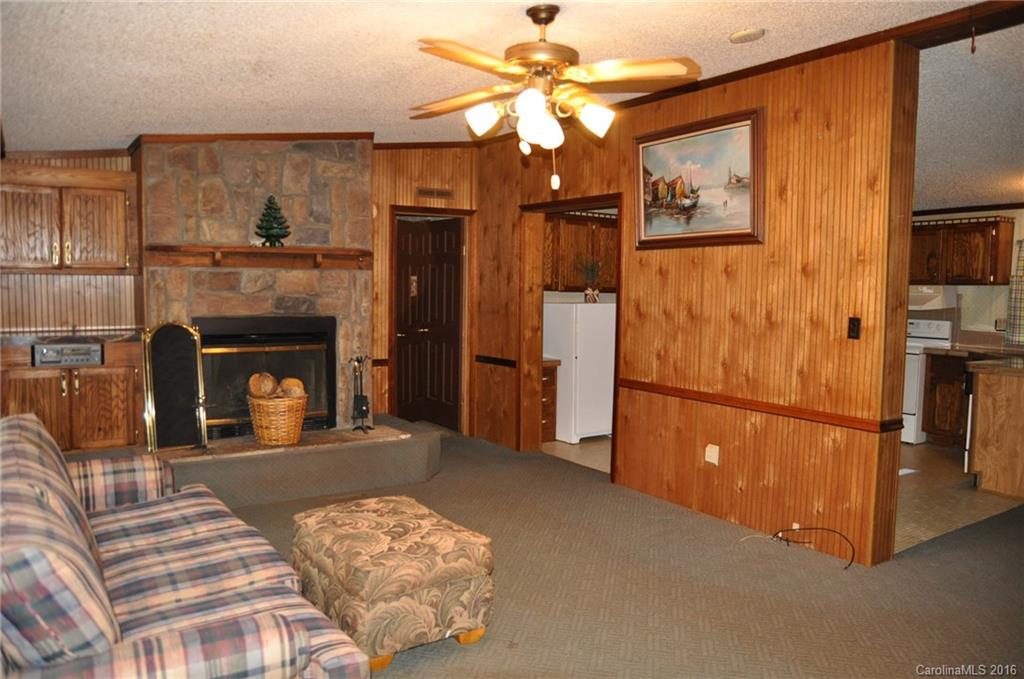 2919 Belk Mill Road Wingate, NC 28174 - Photo 11 of 24 a bedroom with furniture and a fireplace