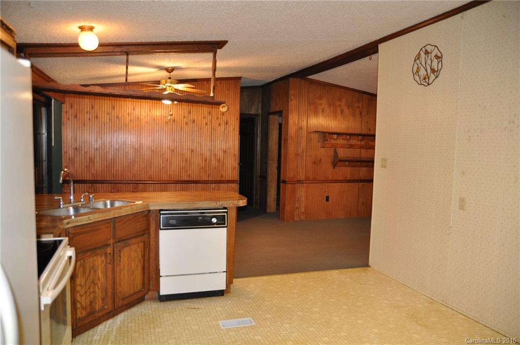 2919 Belk Mill Road Wingate, NC 28174 - Photo 16 of 24 a kitchen with stainless steel appliances granite countertop a refrigerator and a stove