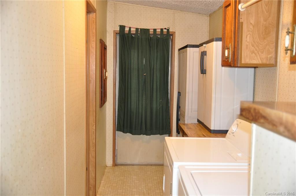 2919 Belk Mill Road Wingate, NC 28174 - Photo 19 of 24 a bathroom with a bathtub and a shower