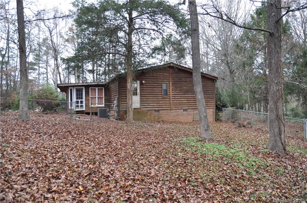 2919 Belk Mill Road Wingate, NC 28174 - Photo 7 of 24 a large tree in the front of a house