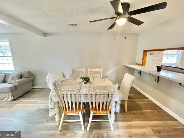 a view of a dining room with furniture