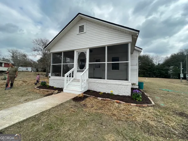 a house with trees in front of it