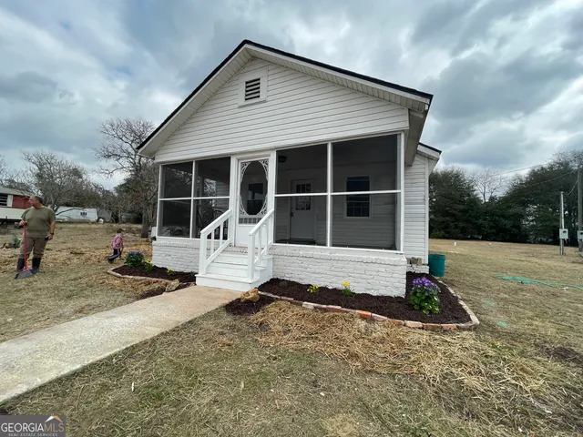 a house with trees in front of it