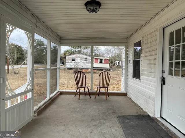 a view of a porch with furniture