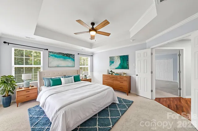 a bedroom with a bed and a couch