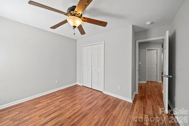 a view of room with wooden floor