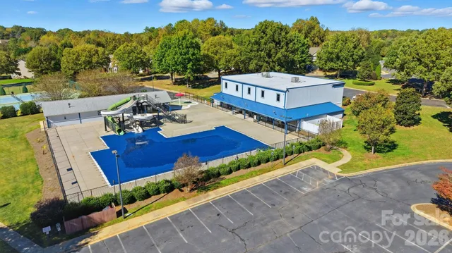 an aerial view of a house with outdoor space