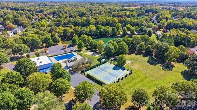 an aerial view of residential house with outdoor space and swimming pool