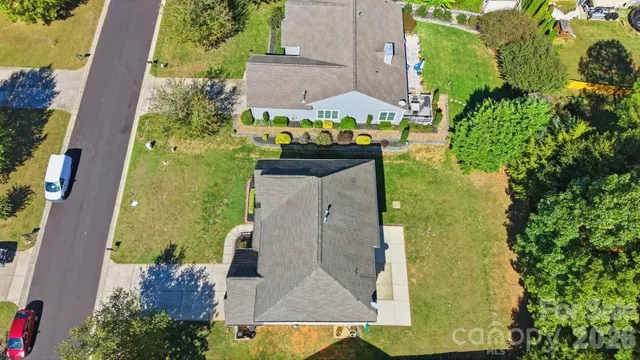 an aerial view of a house with outdoor space