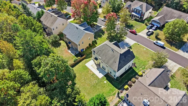 an aerial view of residential house with outdoor space and swimming pool