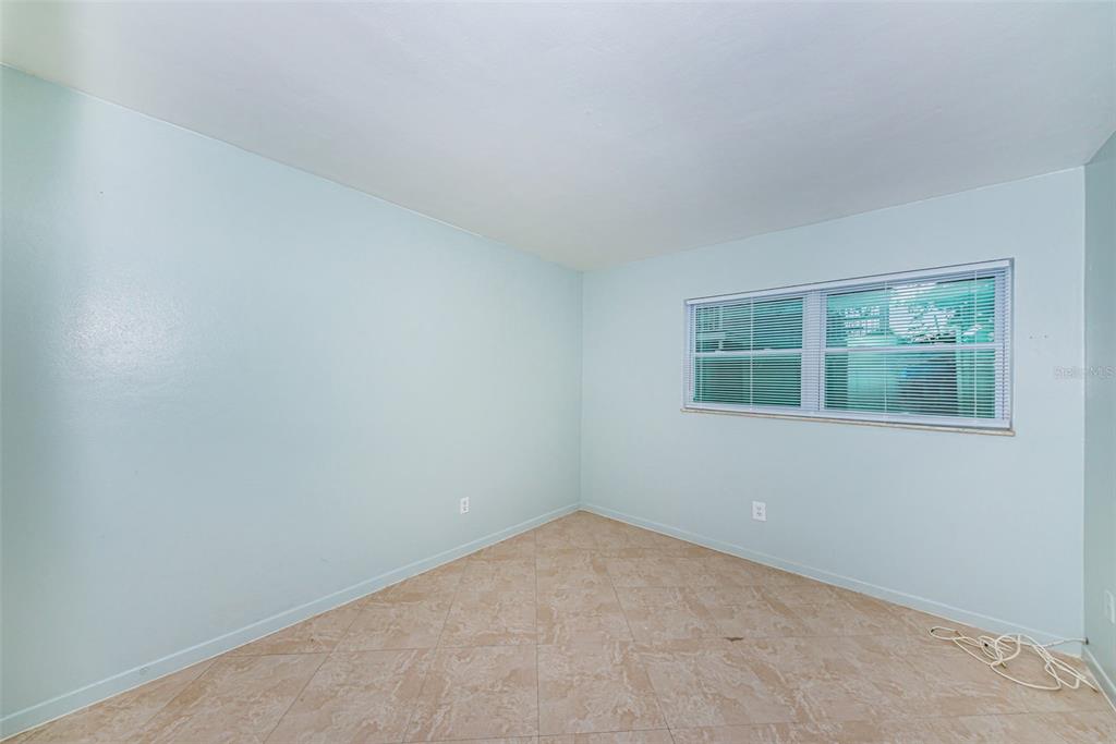 2308 1st Street, Unit 4 Indian Rocks Beach, FL 33785 - Photo 14 of 25 an empty room with windows